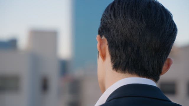 Back of a man in a suit