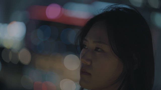 Contemplative Woman In City At Night