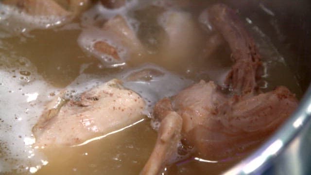 Chicken boiling in a big pot