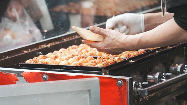 Street vendor cooking takoyaki