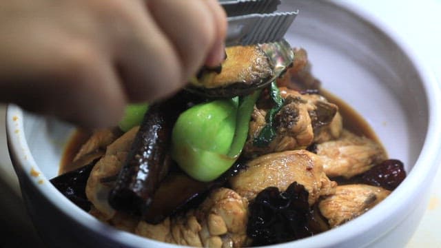 Chinese chicken dish with lots of spices and vegetables