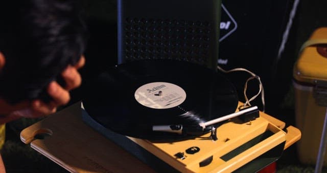 Man Listening to Music on a Vintage Turntable