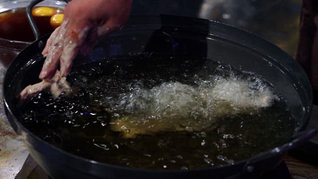 Battered pork in hot oil