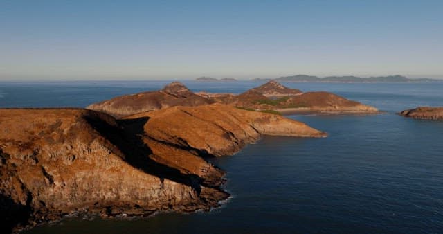 Serene Coastal Landscape with Hills and Sea