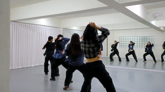 K-POP Dancers Practicing in a Studio