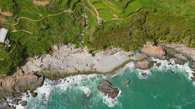 Terraced fields by the rocky coastline
