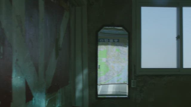 Interior of an old room with a map and a window