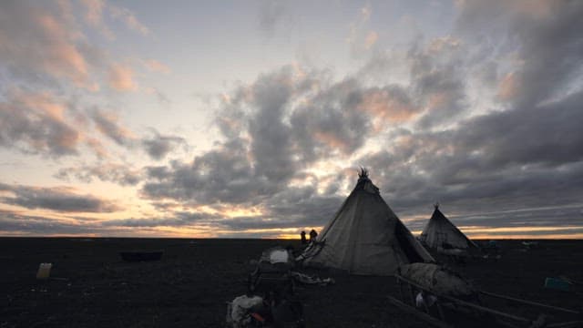 Sunset at a Remote Campsite with Tents