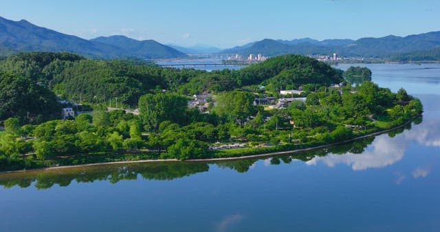 Serene village surrounded by the river and lush greenery
