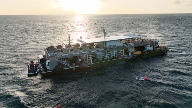 Large cruise ship on the ocean at sunset