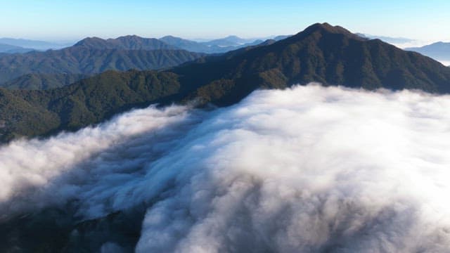 Mountain range covered in clouds
