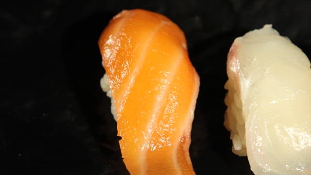 Assorted Nigiri Sushi on a Dark Plate