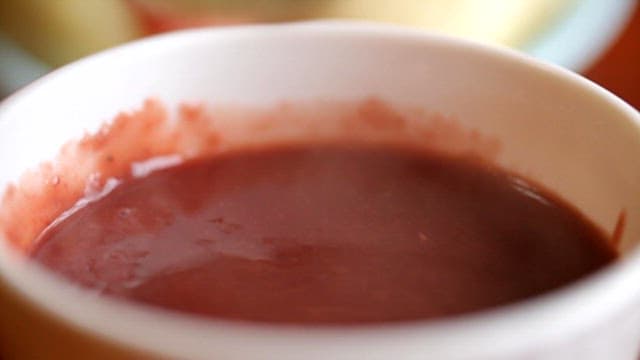 Steamed buns dipped in hot red bean porridge