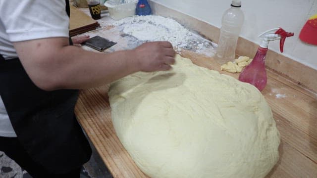 Baker Kneading and Cutting Dough