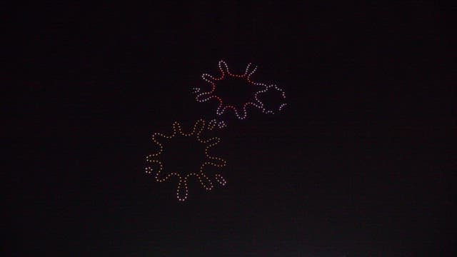 Colorful drone light show in nighttime sky