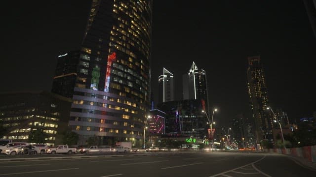 Bustling City Night with Glowing Skyscrapers