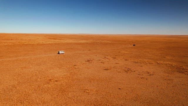 Vehicle Driving in a Barren and Vast Desert