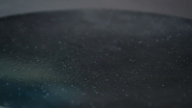 Sticky, clear liquid poured onto a black surface