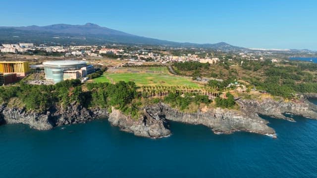Coastal cityscape with cliffs and buildings