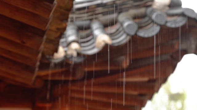 Rain falling on the cozy roof of a Hanok
