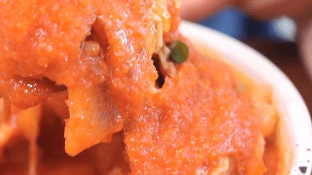 Appetizing cold raw fish soup served on an appetizer plate