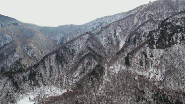 Majestic Landscape of Snow-Capped Mountains in Winter