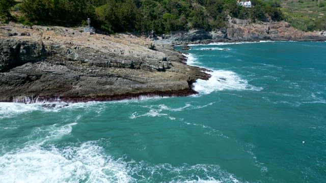 Rugged Coastline and Waves Crashing Against Rocks