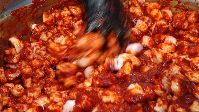 Intestines Mixed with Red Sauce in a Metal Basin