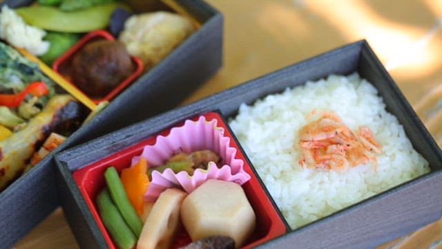 Bento Boxes on Wooden Table Outdoors