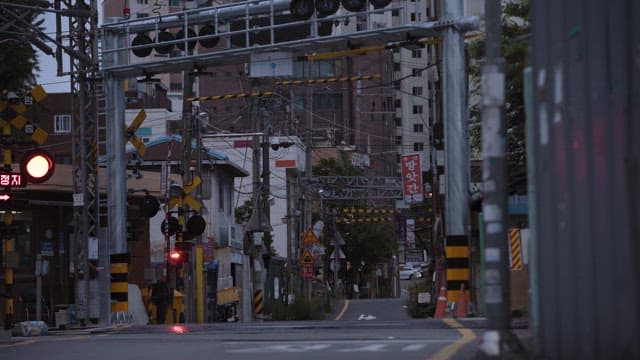 Empty Street at Railroad Crossing with a Stop Sign