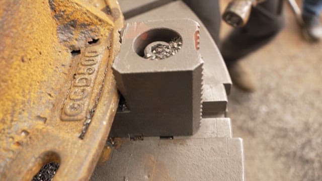 Worker operating a metal machine