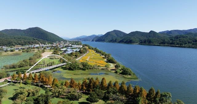 Scenic river with a bridge and mountains