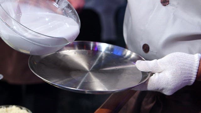 Starch batter pouring onto a tray