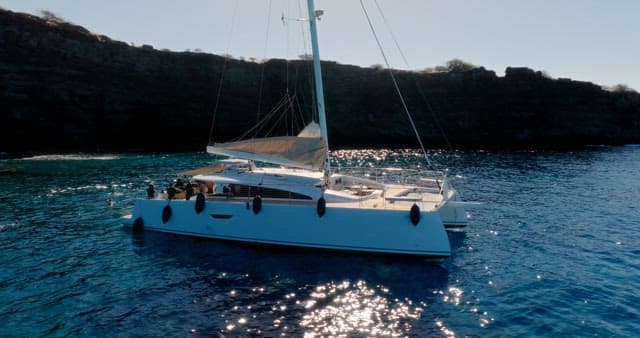 Sailing Yacht Navigating Sparkling Waters