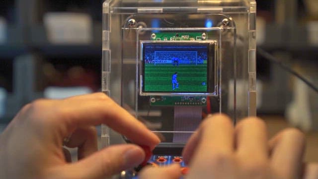 Playing a portable soccer game console