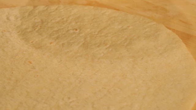 Spread Tomato Sauce on Tortilla Dough