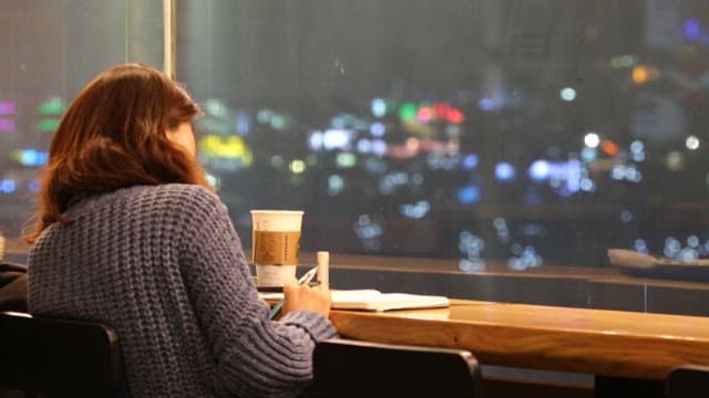 Woman enjoying a moment alone in a cafe