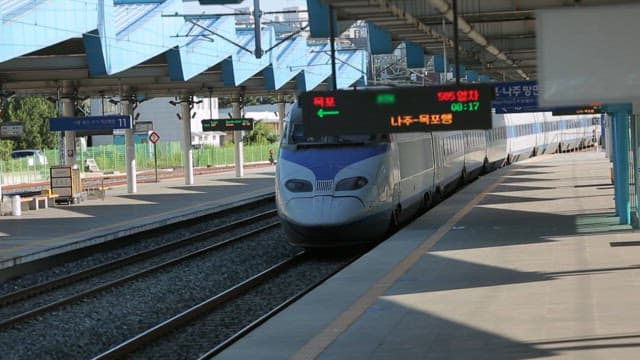 High-speed train entering the station platform in the afternoon