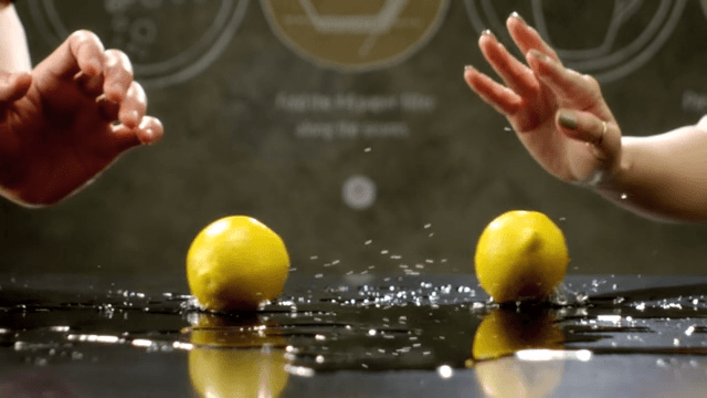 Lemons rolling over a shiny surface
