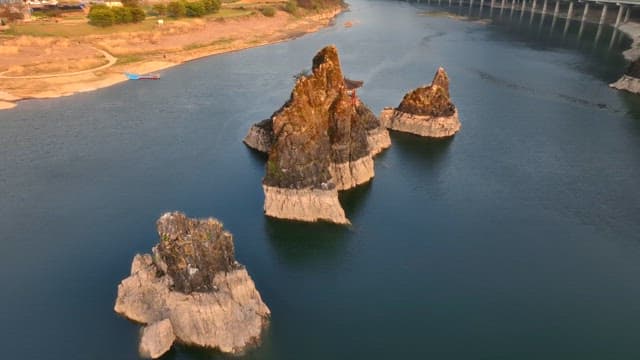 Rocky islets in a serene river