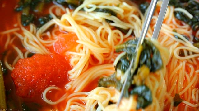 Yeolmu noodles picked up with chopsticks