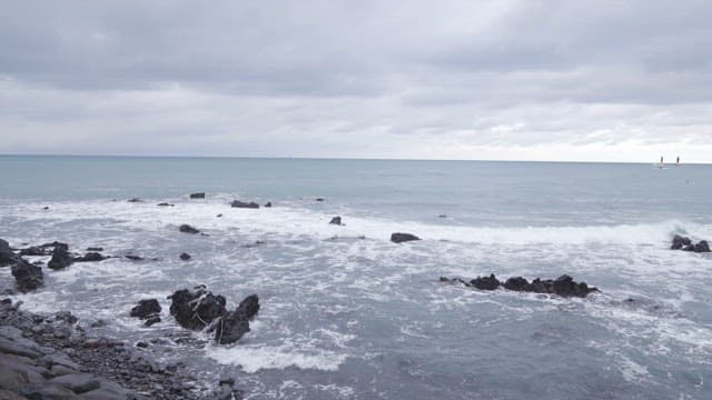 Overcast Skies Over Rocky Coastal Waters