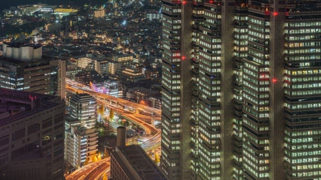 Night view of a bustling city with skyscrapers