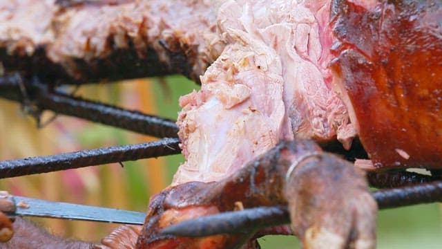 Preparing pork for grilling on an outdoor grill