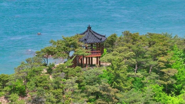 Traditional pavilion by clear blue sea