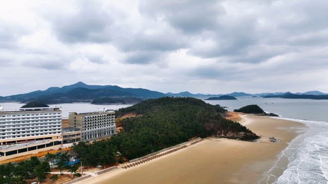 Coastal landscape with mountains and beach