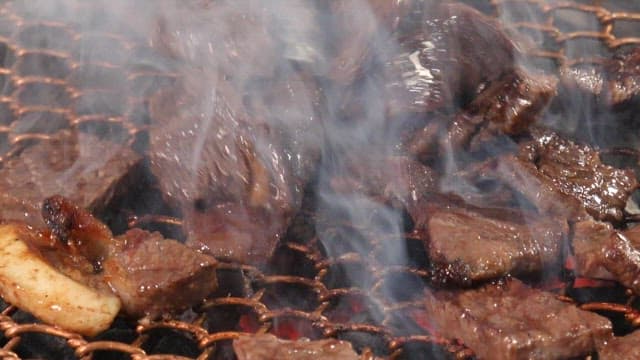 Sizzling beef on a grill