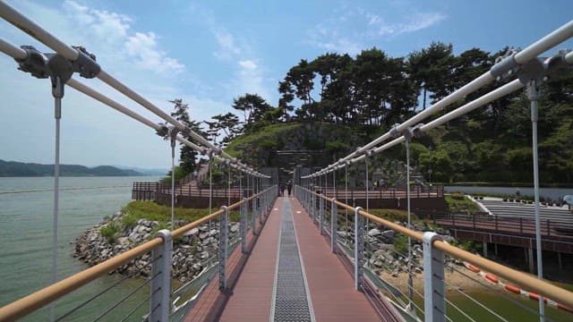 Pedestrian Bridge in Waterside park on a sunny day