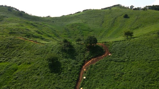 Green mountains with small lakes in sunken terrain