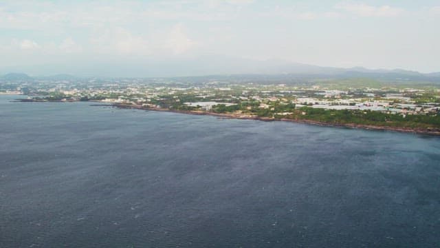 Coastal town with distant mountains